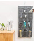 Double Sided Hanging Closet Organizer With Thirty Roomy Pockets In Gray hanging on wall, displaying neatly arranged beauty products and accessories.