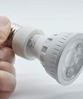 E26 E27 To GU10 Ceramic Socket Adapter Built Tough For Heavy Duty Halogen And Led Spotlight Work UL Certified 660 Watt close-up in hand