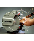 Heavy Duty 8 Inch Bench Grinder With 3600 Rpm And 5.5 Amp Motor in use, sparks flying during metal sharpening.
