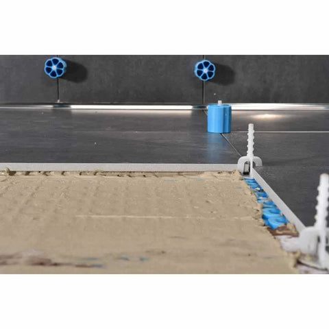Proleveling System 1/32 Inch Extra Linear Leveler Stems Pack Of 100 with caps on tiled floor installation
