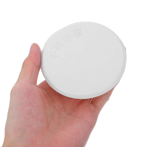 Right On Track Four Pack Flat Round Fire Sprinkler Cover Plates Slick Concealed Ceiling Caps in hand, white iron, 3.34 inch round.