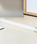 4 Pack Plastic Poster Mailing Tubes With Sealed Caps For Easy Storage And Transport on desk, 3.5cm diameter, 31cm length