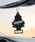 Front view of Little Trees black tree-shaped car air freshener hanging from a rearview mirror, Black Ice scent.
