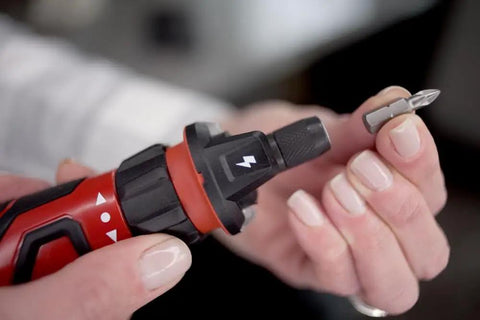 Rechargeable 4V Cordless Screwdriver With Circuit Sensor Technology close-up with bit holder and bit being inserted