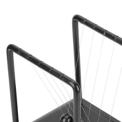 Close-up of the Newtons Cradle Pendulum Desk Toy for Home Office Decor with durable steel balls and plastic frame, 17.8 x 14.8 x 18 cm.