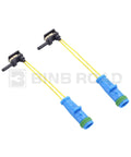 Front view: two brake pad wear sensor cables with blue housings and yellow wires.
