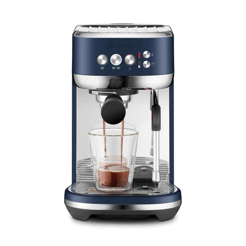 Damson Blue Kickass Espresso Coffee Maker Featuring Auto Milk Frother Quick Heat Technology And Reliable Pressure Pumping For Next Level Barista Quality Home Brews Any Day, brewing espresso into a glass.