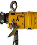Front view of yellow Man Guard air hoist with hook and steel chain, industrial pneumatic hoist