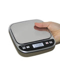 Compact 600G Pocket Scale With 0.01g Precision Tare Function And Backlit LCD For Jewelry Making Gold Silver Gems Powder Medicine And Lab Use Ultra Portable Mini Scale For On The Go Precise Weighing in hand showing LCD display.