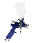 Heavy-Duty 0.8mm Pneumatic Airbrush With 125ml Gravity Feed Cup showcasing precision components and ergonomic design for flawless paint projects.