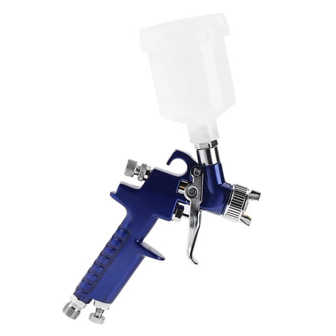 Heavy-Duty 0.8mm Pneumatic Airbrush With 125ml Gravity Feed Cup showcasing precision components and ergonomic design for flawless paint projects.