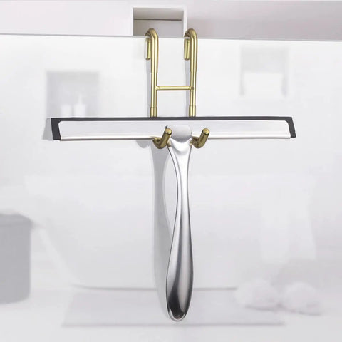 Over Door Shower Hooks 304 Stainless Steel Towel Hangers No Drill Bathroom Hanger For Frameless Doors Up To Half Inch Thick Gold Finish 2 Pack With Rubberized Protective Grips holding a shower squeegee on glass door.