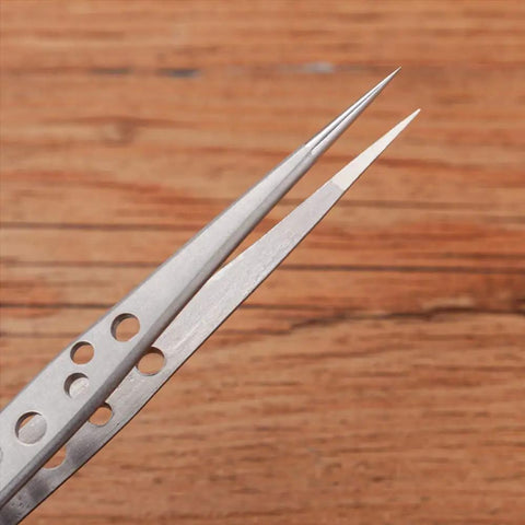 Close-up of stainless steel tweezers tips from Five Piece Stainless Steel Tweezers Set For Electronics Repair And Crafting