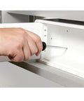 Hand mounting Lockable Safe For Meds With Patented Locking Mechanism Steel Reinforced Body in a drawer, white finish