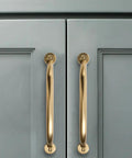 3 Inch Hole Center Brushed Brass Cabinet Pulls 10 Pack Heavy Duty Solid Drawer Handles installed on gray cabinet doors