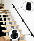 Rock Solid Black Metal Wrought Iron Stair Railing With Modern Wall Mount Handrail For Indoor And Outdoor Use installed beside wooden steps.