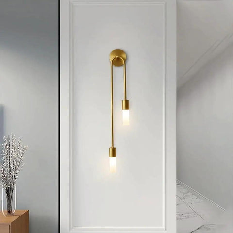 UPRENXIAO Modern Wall Sconce Linear Curved Design Up Down Lighting Ambient(Gold) on a white wall with elegant dual lamps.