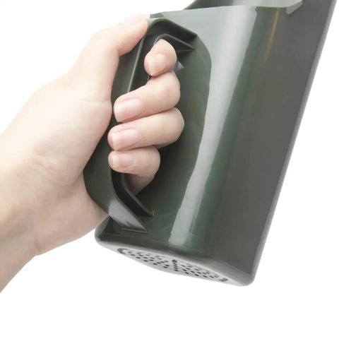 Hand holding Go To Garden Scoop Shovel A Versatile Plastic Digging Tool For Soil And Compost With A Comfy Grip Handle Ideal For Pots And Succulents