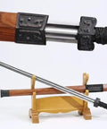 Hand-Forged Damascus Han Sword With 42-Inch Battle-Ready Chinese Longquan Blade placed on a wooden stand, rosewood handle visible