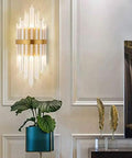 Modern Clear Crystal Wall Sconce With Slick Diamond Etching And Bright Up Down Lighting For Bedroom Foyer Or Dining Nook Top Shelf Gold Hardware Fast Mount Good Vibes Smooth Room Refresh mounted on wall with plants.