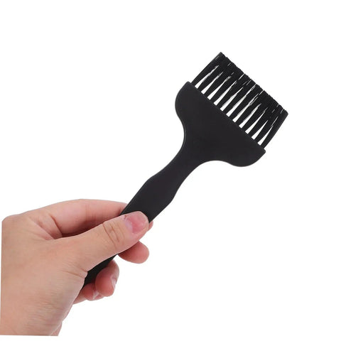 Hand holding black Anti Static Cleaning Brush Kit With Flexible Bristles And Handy Crank Handle For Keyboard, Sewing Machine, And Electronics Maintenance In Lab And Factory Settings Your Go To Gadget Care Kit