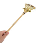 Hand holding Solid Bamboo Garden Rake For Sandboxes And Landscaping, Lightweight Eco Friendly Yard Tool, 19.7 Inch, Japanese Inspired Design