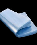 Hassle Free 100 Pack Clear Pvc Heat Shrink Bags 7X10 Inches stacked showing smooth, transparent pouches for gift wrapping and packaging.