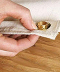 Close-up of hand using Heavy Duty Brass Grommet Kit Half Inch Eyelets For Tarps Fabric And Tents, showing grommet in fabric