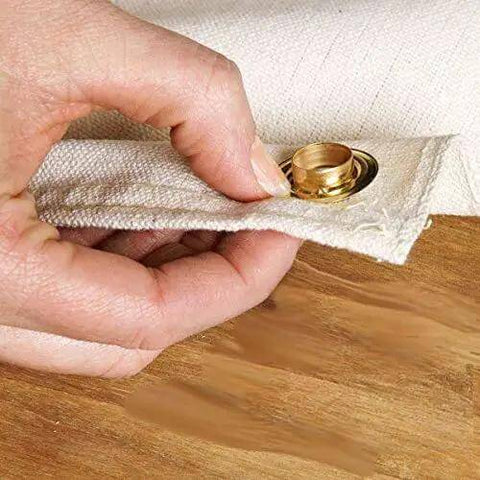 Close-up of hand using Heavy Duty Brass Grommet Kit Half Inch Eyelets For Tarps Fabric And Tents, showing grommet in fabric