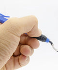 Deburring tool with blue handle and curved swivel blade, close-up view.