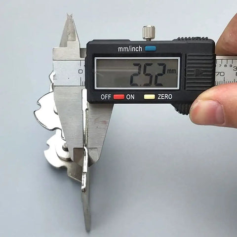 Measuring 2.5 mm thick heavy-duty self locking folding hinges for tables and cabinets with caliper. Silver steel material.