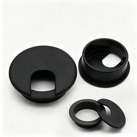 Premium Desktop Grommet Covers Slick Cable Organizers Hella Tough ABS Plastic Wire Routing Kit For Working From Home Office Setup No Mess Cord Management 5 Pack Black Two Point Five Inch Opening Sweet Fit Design close-up of black grommet covers