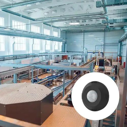 Twist To Lock Motion Sensor For Outdoor Lighting in large warehouse setting, IP66 rated black accessory for luminaires shown in use