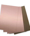 10 Pack Single Sided FR4 Copper Clad PCB Boards 100mm By 70mm By 1.5mm for DIY projects, shown in a layered stack.
