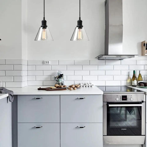 Retro Edison Style Pendant Light With Clear Glass Shade For Kitchen Island Dining Room Classic Retro Vibe Industrial Black Mini Flush Mount Fixture E26 Base 40W Bulb Not Included Ideal For Living Room Bathroom Porch Bar Hotels illuminating a modern kitchen.