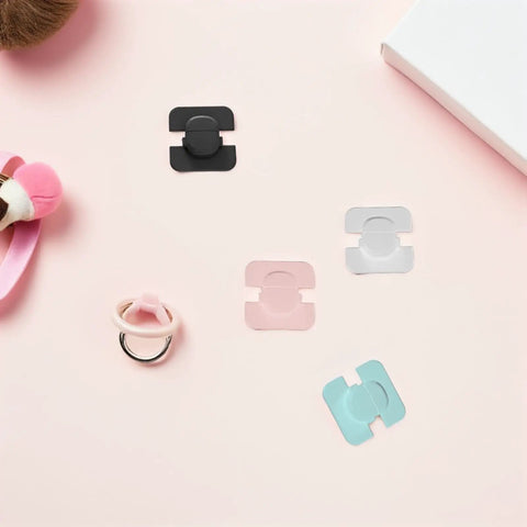 4 Pack Kid Proof Fridge And Cabinet Latch Set With Invisible Design Made From ABS Material For Safe Home And Kitchen Use Easy No Tool Installation Keeps Curious Toddlers Safe In Cabinets shown in pink, black, clear, and blue on a pastel background.
