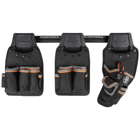 Three Tradesman Pro Modular Drill Pouch with Belt Clip for Click Lock System on a modular wall rack.
