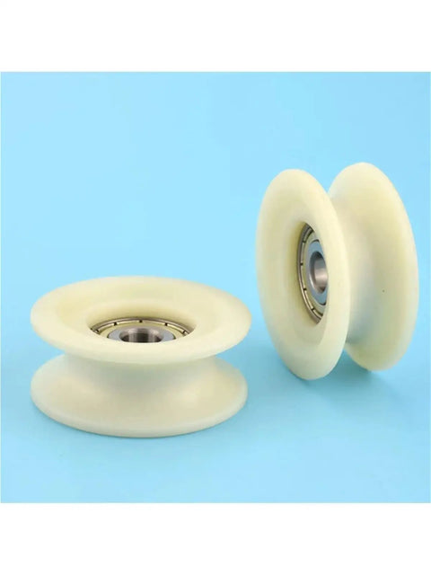 Heavy Duty U Groove V Groove Nylon Caster Wheel With Steel Bearing Built Tough Rolling Smooth For Sliding Gates Industrial Trolleys And Machinery Tracks showing two nylon wheels with steel bearings on a blue background.