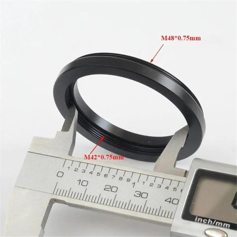 Close-up of Beefy Aluminum M48 To M42 Thread Adapter Ring 0.75mm with caliper showing M42 0.75mm internal thread measurement