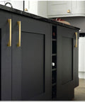4 Pack Brushed Gold Cabinet Drawer Pulls In Zinc Alloy With Brushed Brass Finish installed on black kitchen cabinet doors.