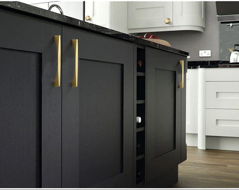 4 Pack Brushed Gold Cabinet Drawer Pulls In Zinc Alloy With Brushed Brass Finish installed on black kitchen cabinet doors.