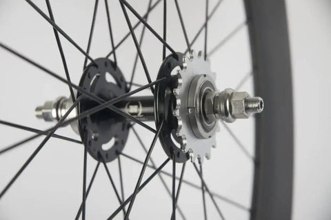 Close-up of Tri Spoke 88mm Carbon Wheelset for 700c Clincher Fixed Gear Track Bikes, showing rear hub and spokes detail.