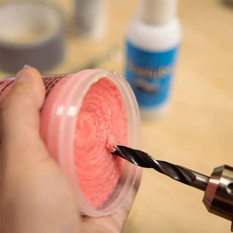 Boss Grade Synthetic Lubricant Paste For MQL Metalworking Industrial Pink Hard Paste Multi Use 4 Oz in use with a drill bit