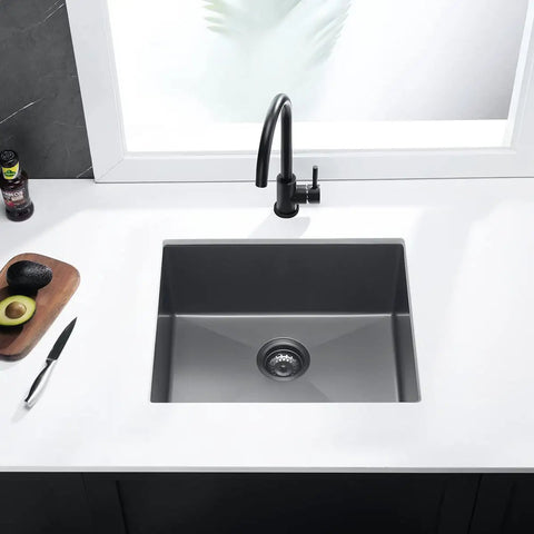 Top view of a drop-in kitchen sink single bowl workstation stainless steel 16 gauge black with strainer in a modern kitchen setup.