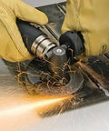 User operating a 4 Inch Depressed Center Angle Grinder With 0.7 HP, 12000 RPM Steel Motor for metal grinding and weld slag removal.