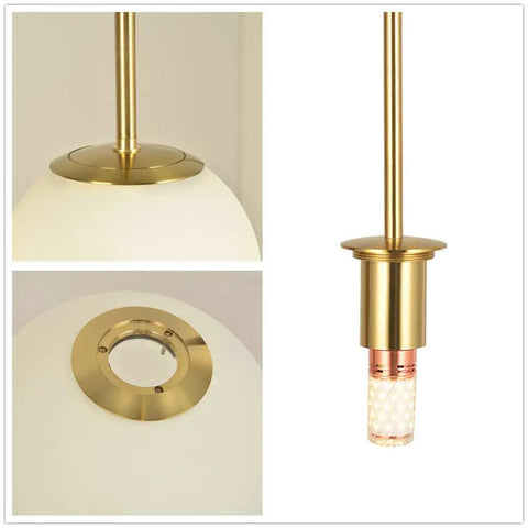 Close-up of Dope Globe Pendant Light With Matte White Glass And Brass Finish One Light Mid Century Modern Ceiling Fixture