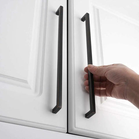 Person holding Oil Rubbed Bronze Solid Square Bar Cabinet Pull Handles Set Of 5 10 Inch 256mm Screw Hole on white cabinet