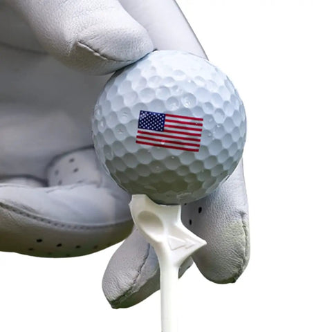 Gloved hand holding golf ball on Diamond Golf Tees That Cut Spin For Longer, Straighter Drives And Zero Friction Feel, 3.25 Inch Tees