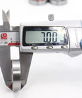 Measuring 18x28x7 Millimeter Double Sealed Ball Bearing 2RS thickness with digital caliper for bicycle hub front and rear wheels.