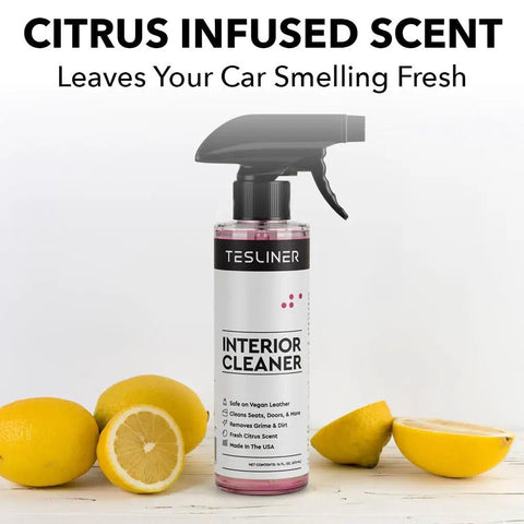 Tesla Seat Cleaner And Stain Remover For Black And White Vegan Leather Interior bottle with lemon slices on a white background